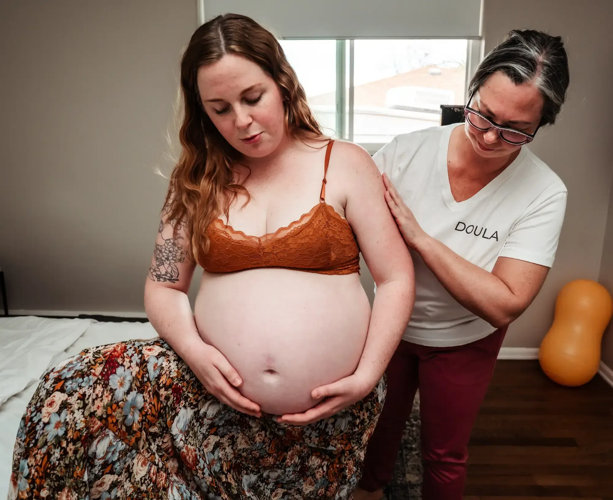 Kristi Fulton, birth doula, supporting a laboring mother